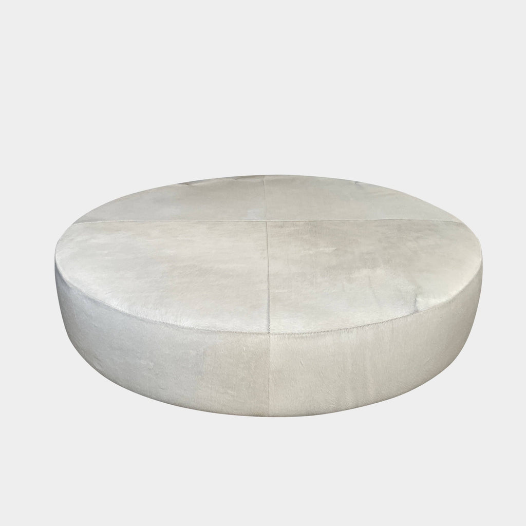 Upholstered, light-colored B&B Italia Harry Large Ottoman isolated on a white background.
