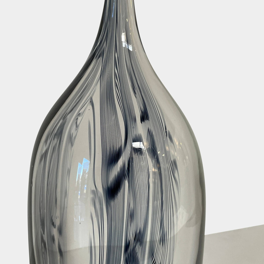 Three Glass Sculptures by Lianne Gold on a white surface, showcasing contemporary design.