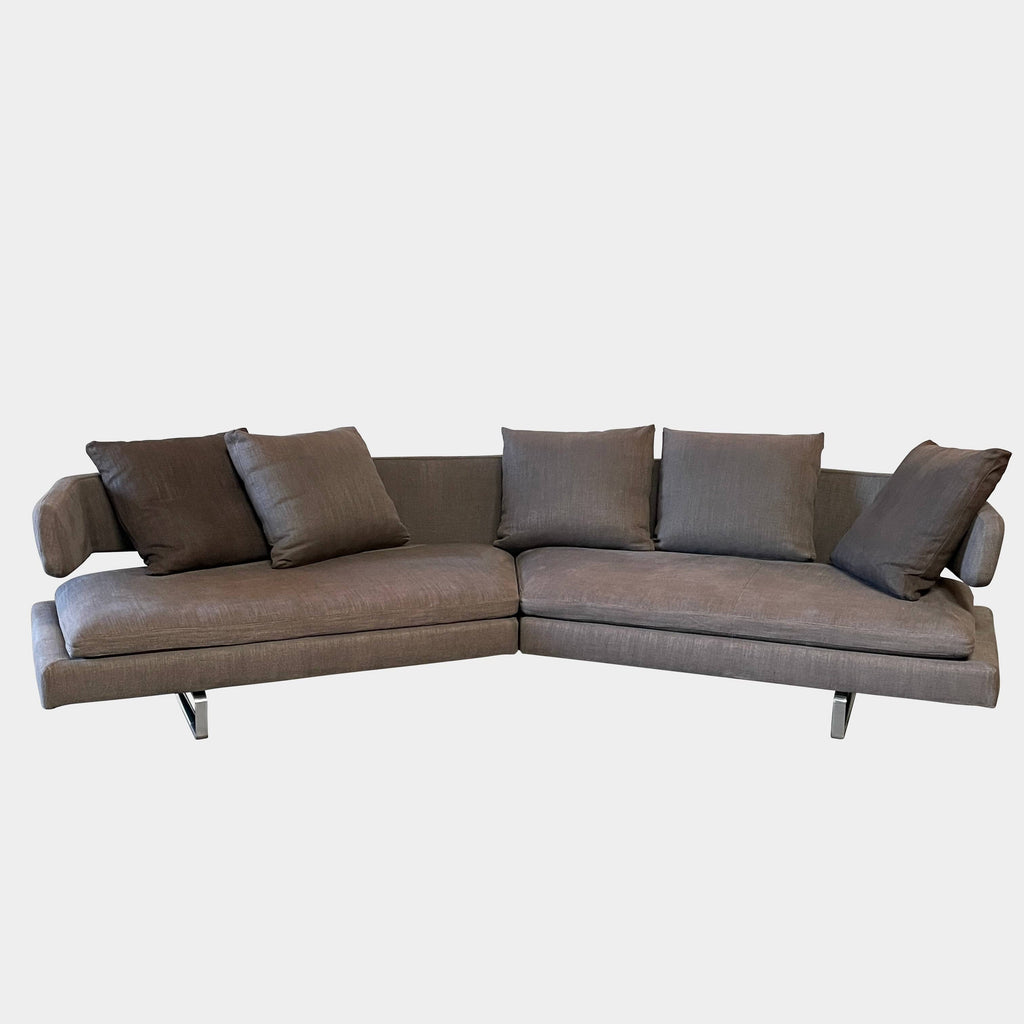 Modern upholstered l-shaped sectional B&B Italia Arne Sofa designed by Antonio Citterio, with cushions on a white background.