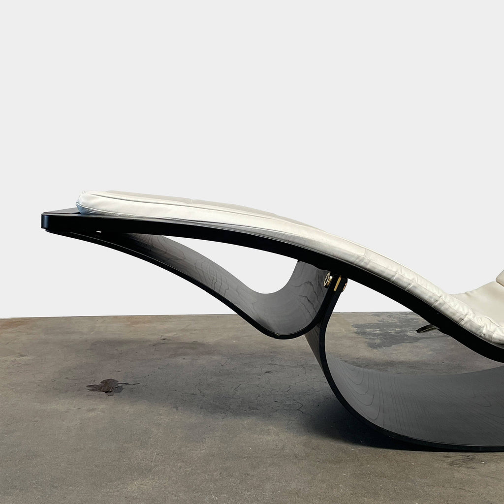 A black and white Niemeyer Rio Rocking Chaise Lounge by Fasem on a white background.