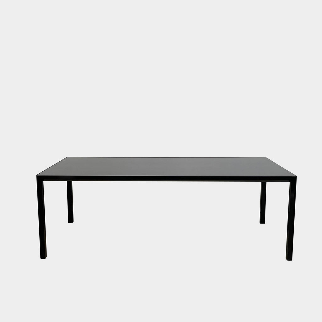 A simple Ligne Roset Seram Dining Table on a white background.