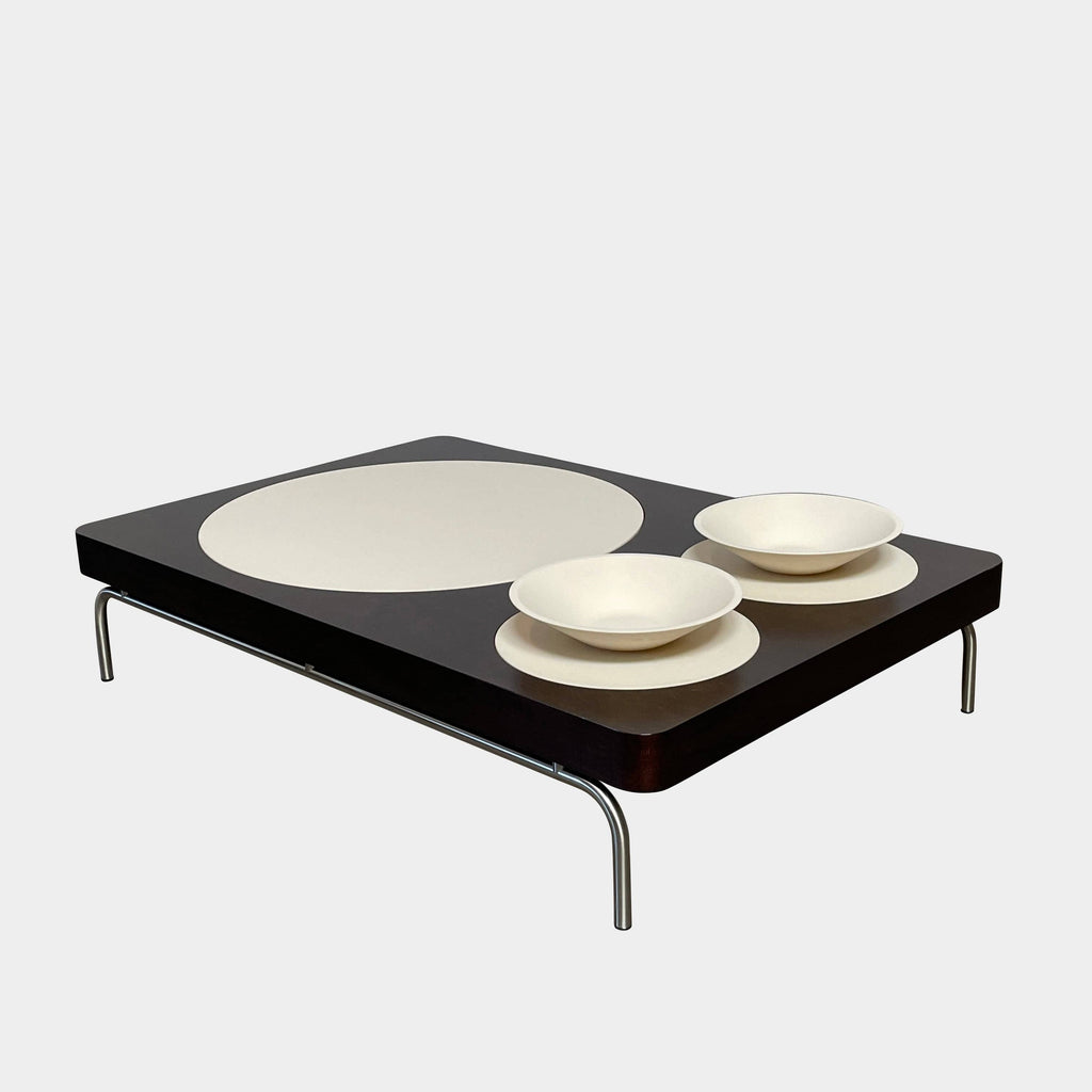 Giorgetti Camaleo coffee table with a dark finish and three white oval insets on metal legs.