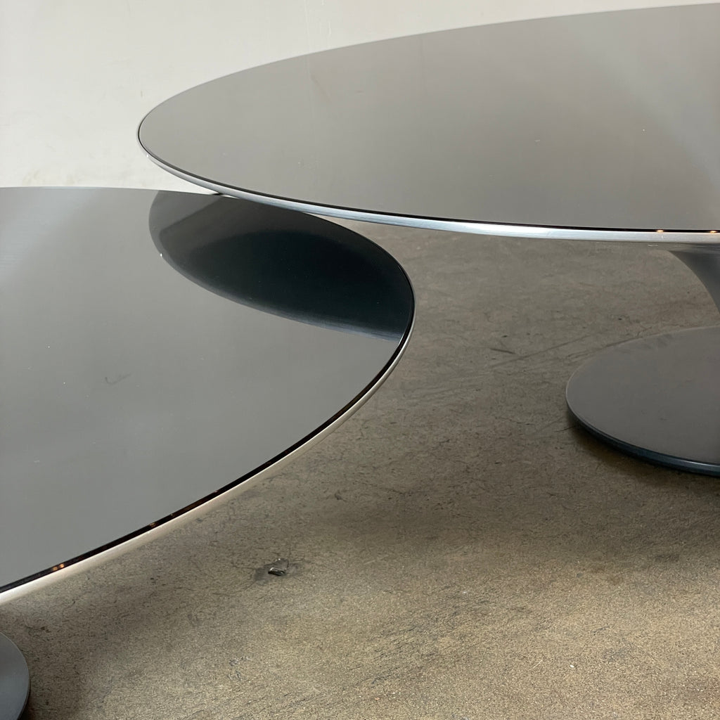 Three Roche Bobois Ovni Cocktail Tables of different sizes with reflective surfaces, isolated on a white background.