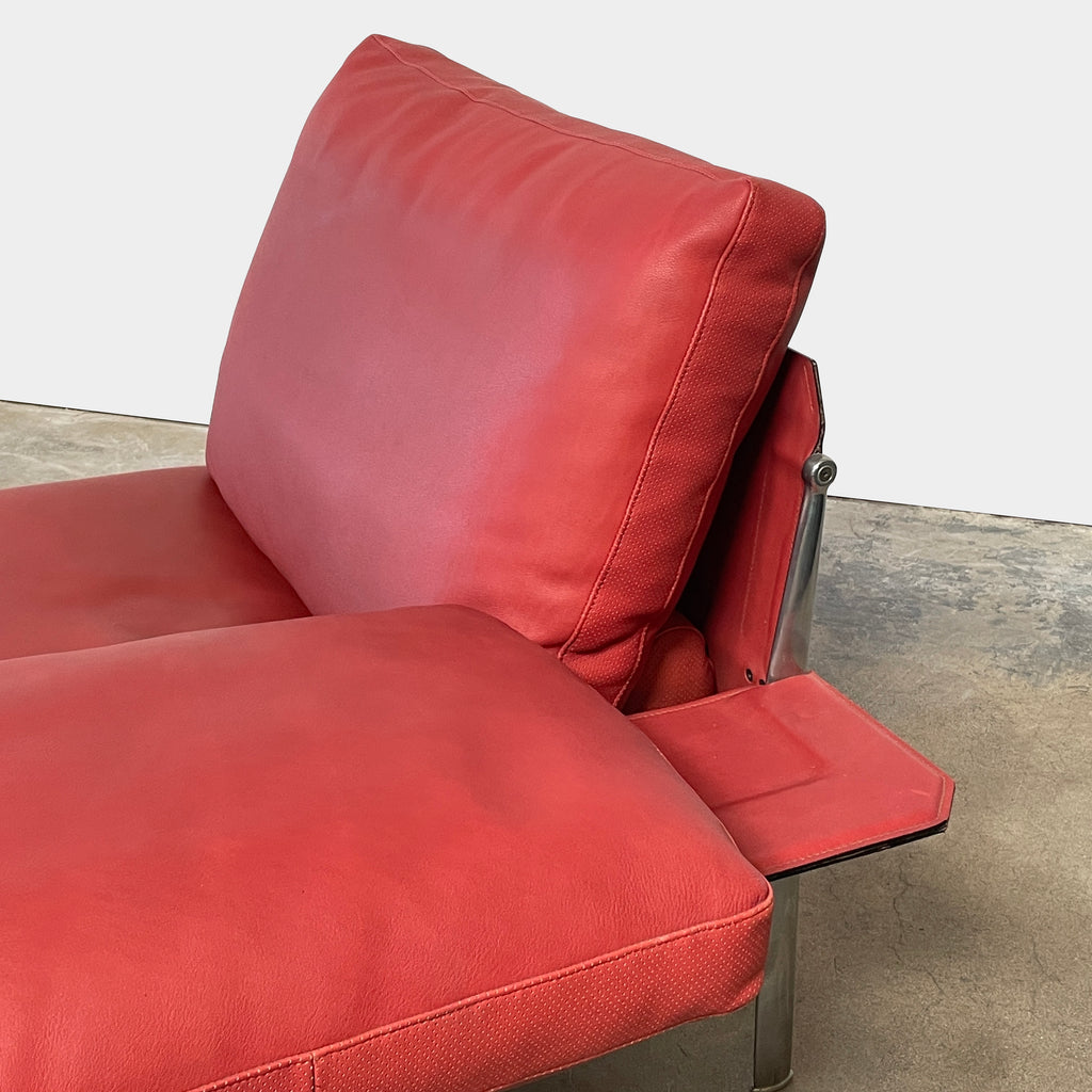 A B&B Italia Diesis red leather chaise lounge on a metal frame.
