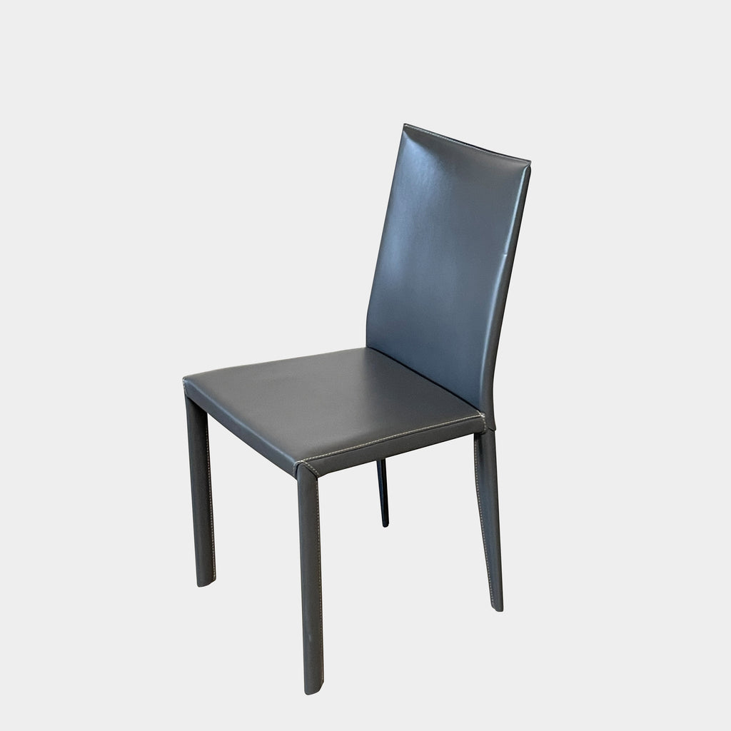 Four Frag Bella Dining Chairs in Dark Grey Leather with metal legs, arranged in a straight line against a plain white background.