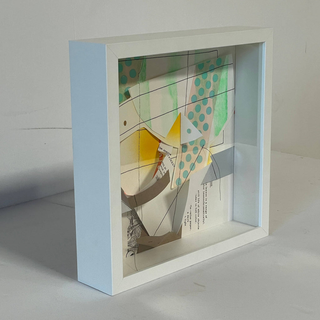A white frame with a piece of paper in it: "Collage: Untitled 3" by Allison Caesar.