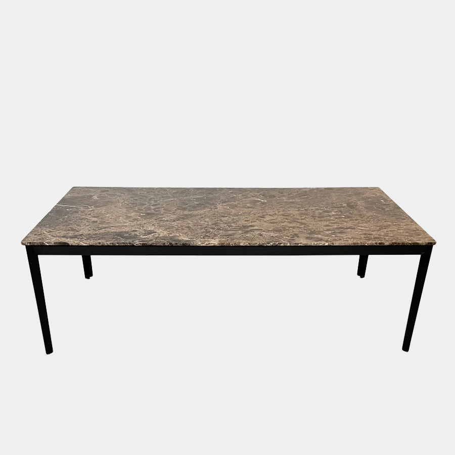 An Arflex Hug Marble Dining Table with black legs, offering clean lines and a modern statement piece.