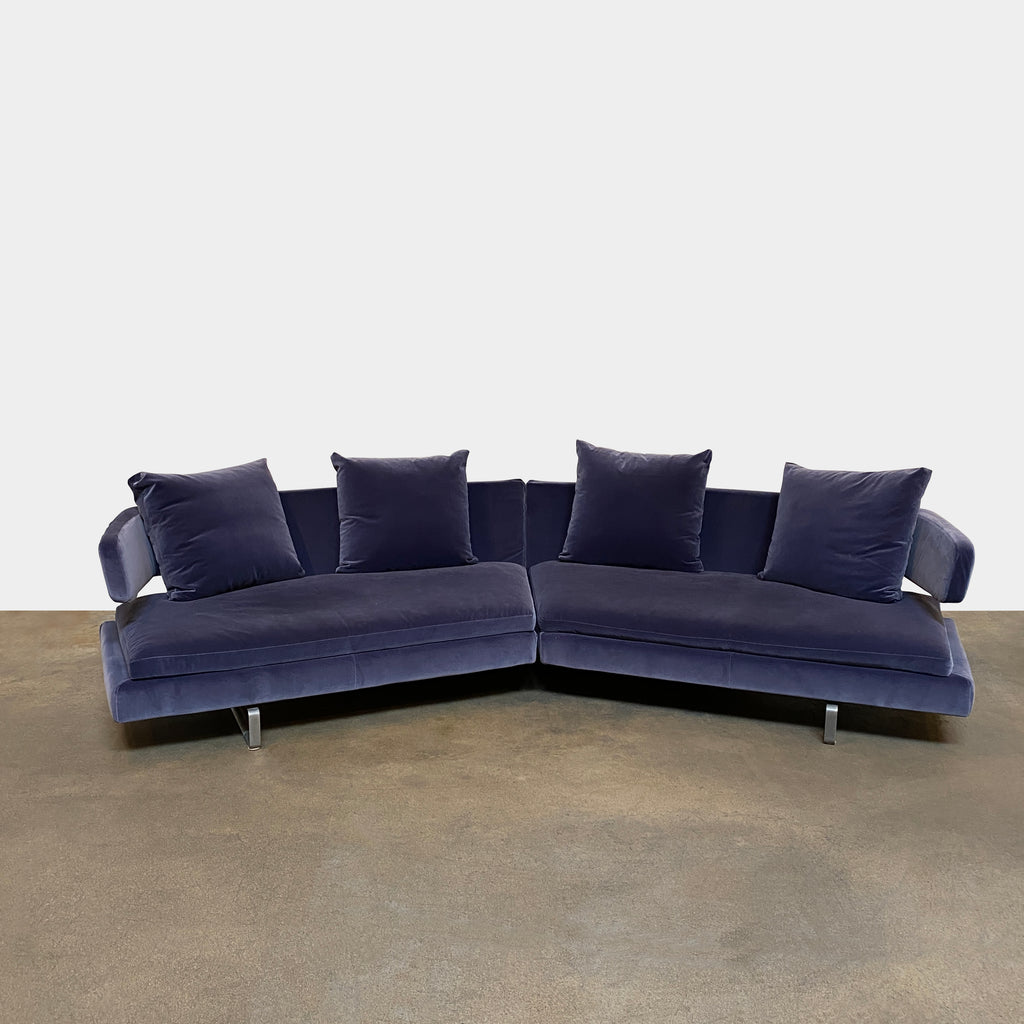 A Arne Sectional with two pillows on it, priced at $300.