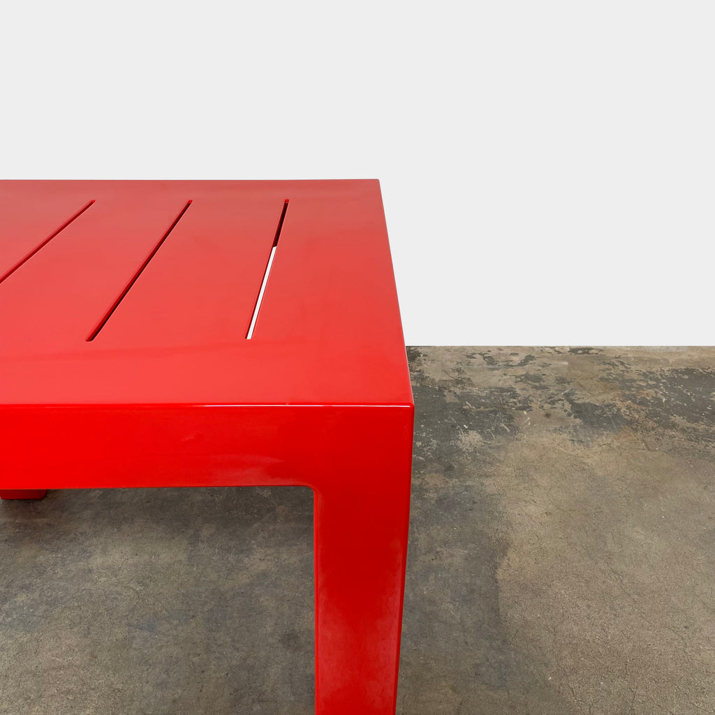 A Vondom weather-resistant red side table on a white background.