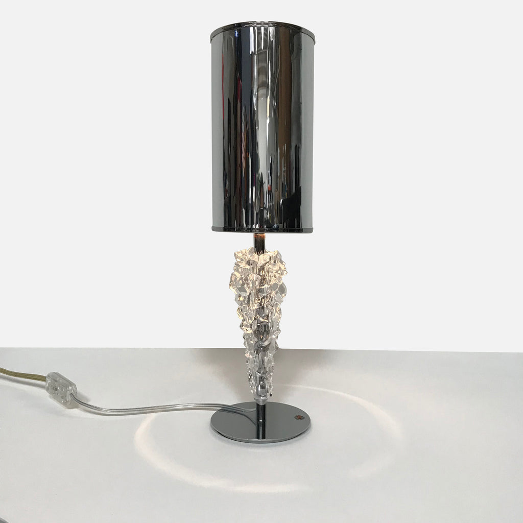 The AXO Light Subzero Table Lamp, designed by Manuel Vivian for AXO Light, features a sleek chrome base and a stunning glass shade.