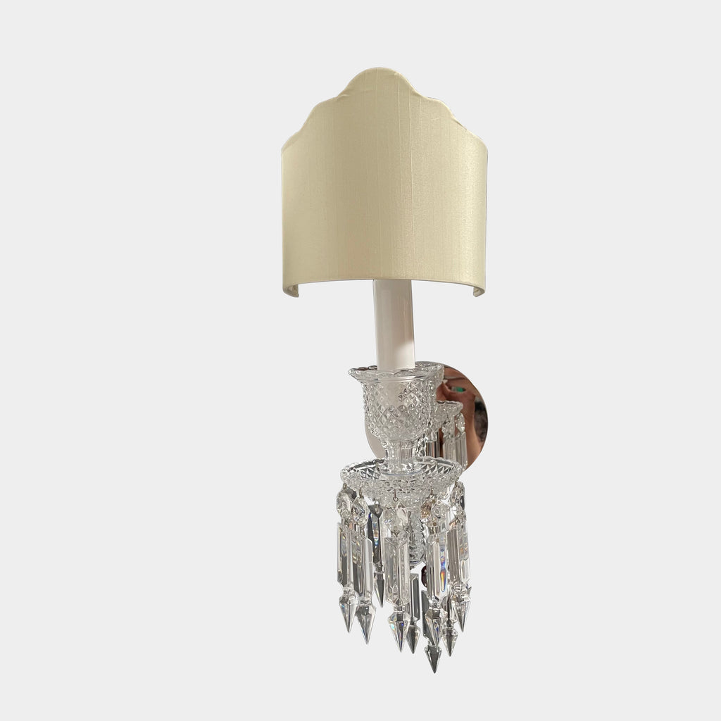 A Baccarat Zenith Wall Sconce with a beige shade.