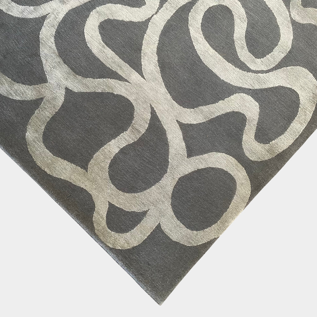 A Delinear Andy rug featuring swirls in grey and white colors, crafted from Himalayan wool and silk.