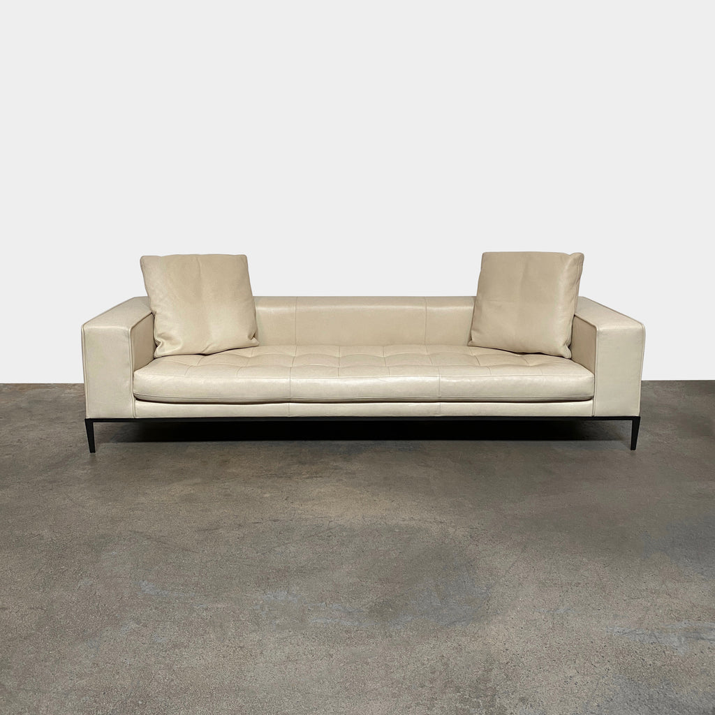 A Maxalto Simplex Sofa with wide structured arms on a white background.