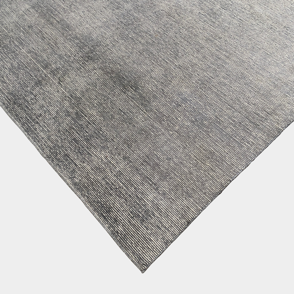 A luxurious Mansour Modern Abrash rug on a white background.
