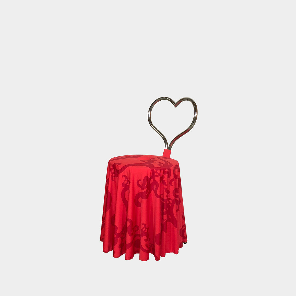 A Cerruti Baleri Red Ballerina Chair on a white background by Marcel Wanders.