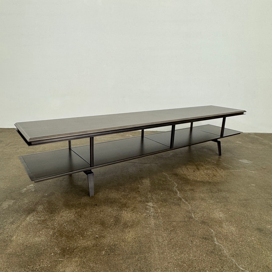 The Gallotti & Radice Pandora Console is a modern black TV stand featuring two open shelves and slim legs, shown on a plain white background. Check dimensions to ensure it fits your space perfectly.