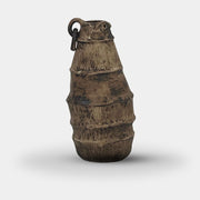 The Sofi Ceramic Bali Vase Long by Sofi Ceramics stands upright on a white background, showcasing rustic elegance with its textured finish and handcrafted vessel design, reminiscent of sculptured pieces.