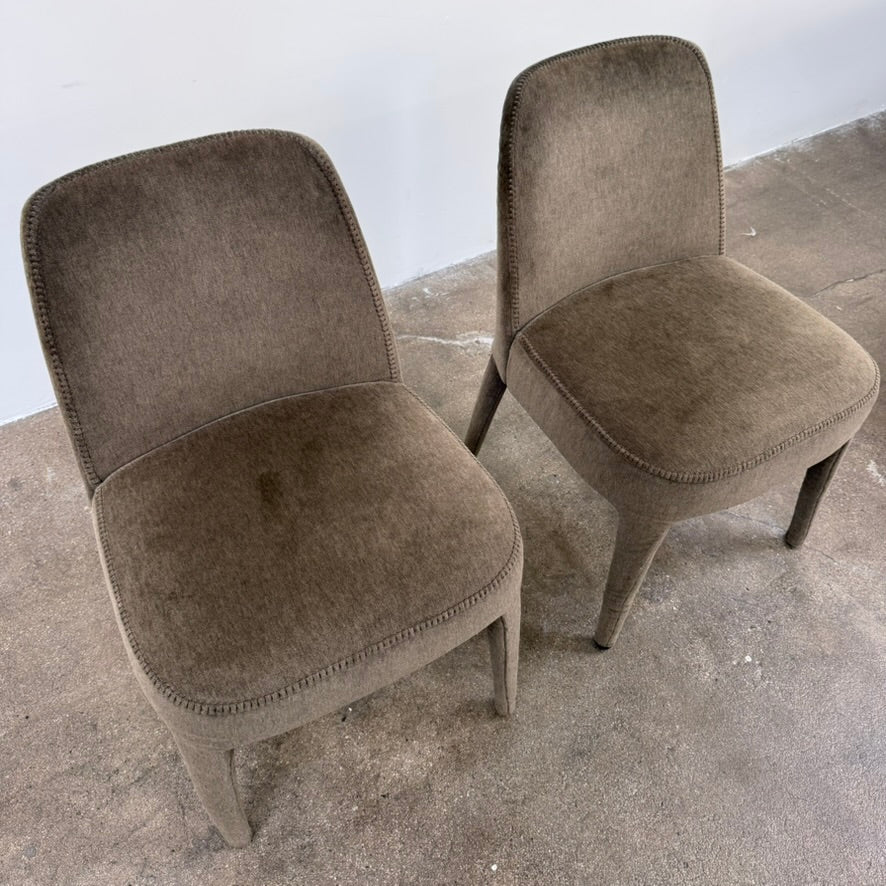 Two dark gray Maxalto Febo dining chairs with backrests, leather upholstery, and four tapered legs.