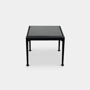 The Knoll 1966 Outdoor End Table in Onyx features four straight legs with rounded feet and a weather-resistant finish, making it ideal for outdoor living. Shown against a plain white background.