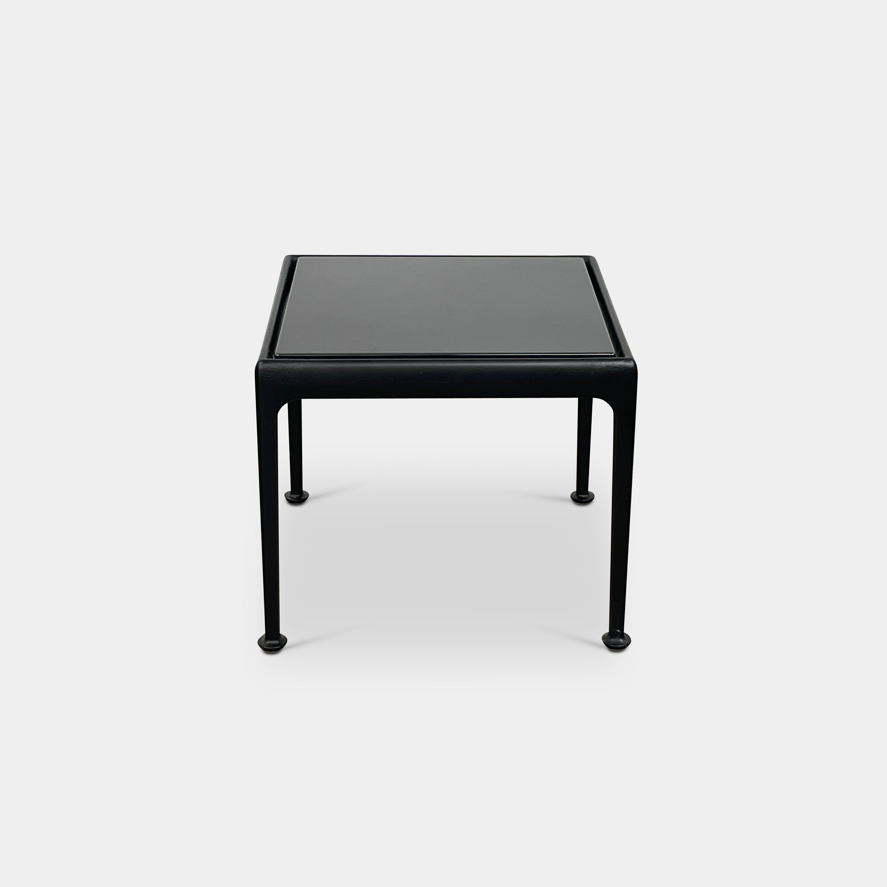 The Knoll 1966 Outdoor End Table in Onyx features four straight legs with rounded feet and a weather-resistant finish, making it ideal for outdoor living. Shown against a plain white background.