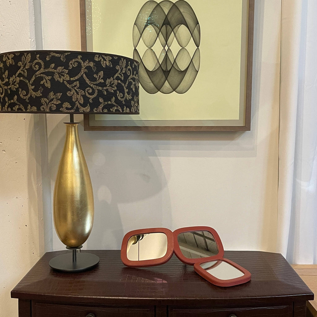 The Penta Gold Leaf Table Lamp by Penta is a glamorous reinvention of a classic with its gold and black design. It features a black shade, adding an elegant touch to any space.