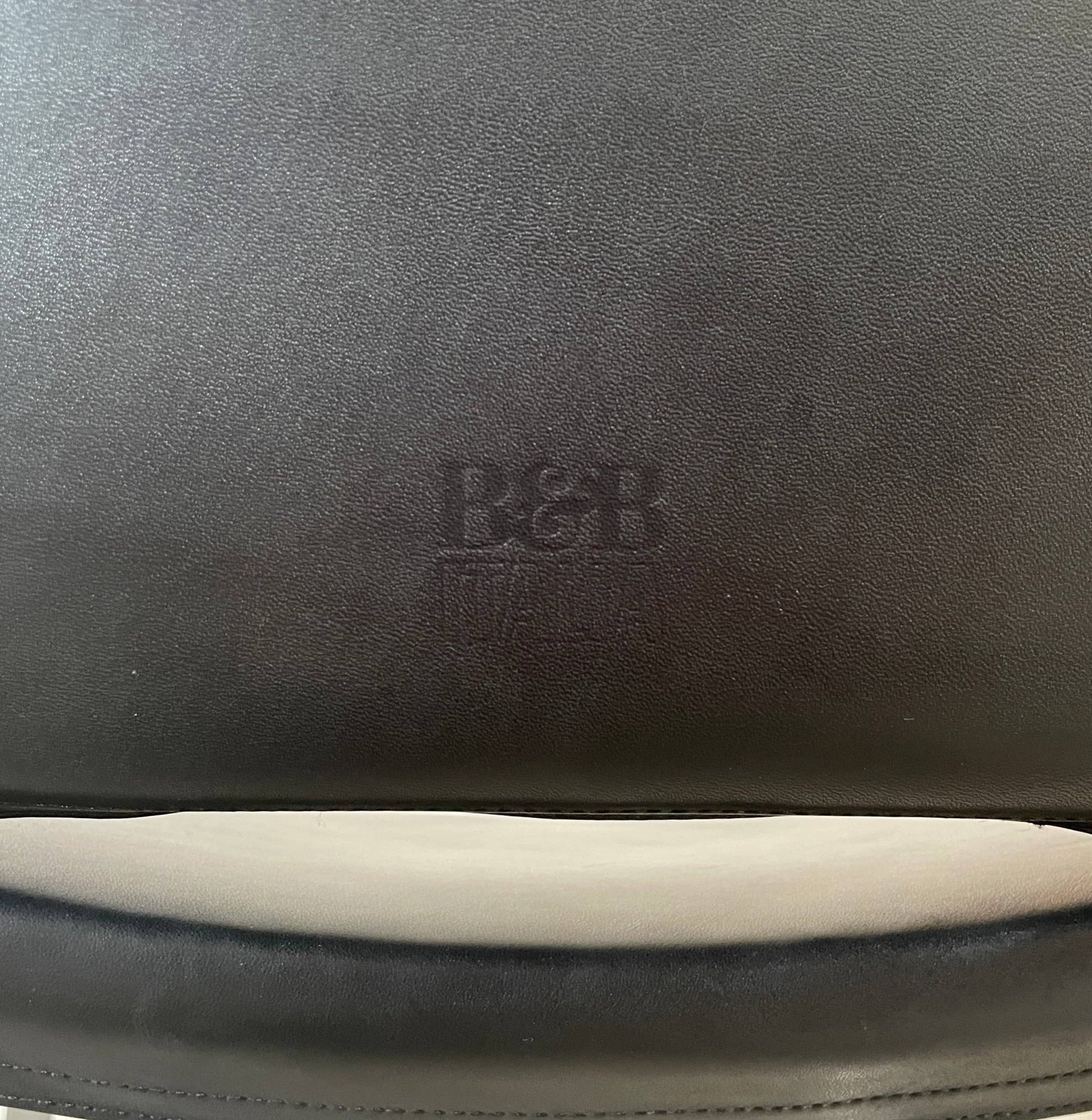 Five black B&B Italia Metropolitan dining chairs designed by Jeffrey Bernett, arranged in a row on a white background.