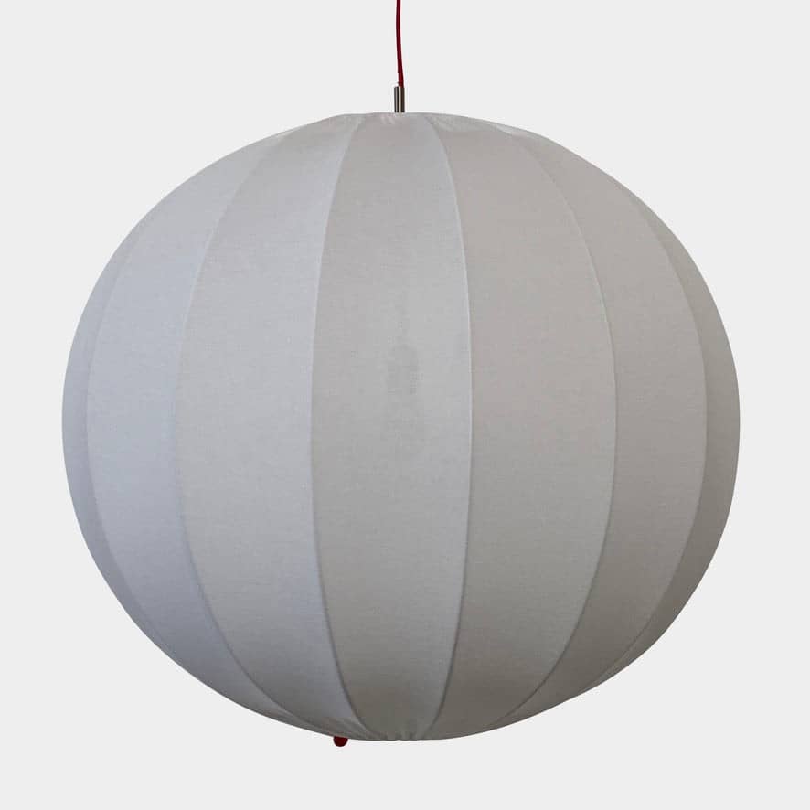 A Penta Balloon Light hanging lamp on a white wall.