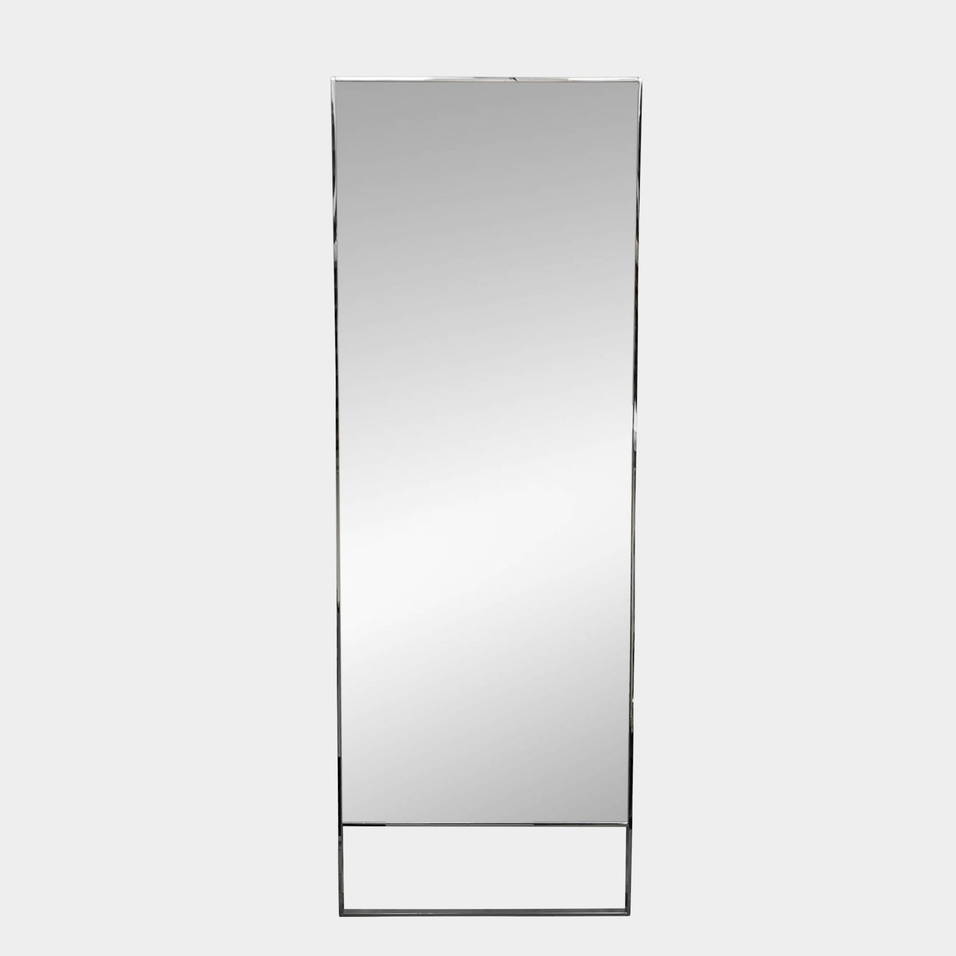 The Maxalto Psiche Mirror SMS1 Chrome, featuring a slim metallic frame, stands upright against a plain light gray background, reflecting the signature elegance of the Maxalto brand.