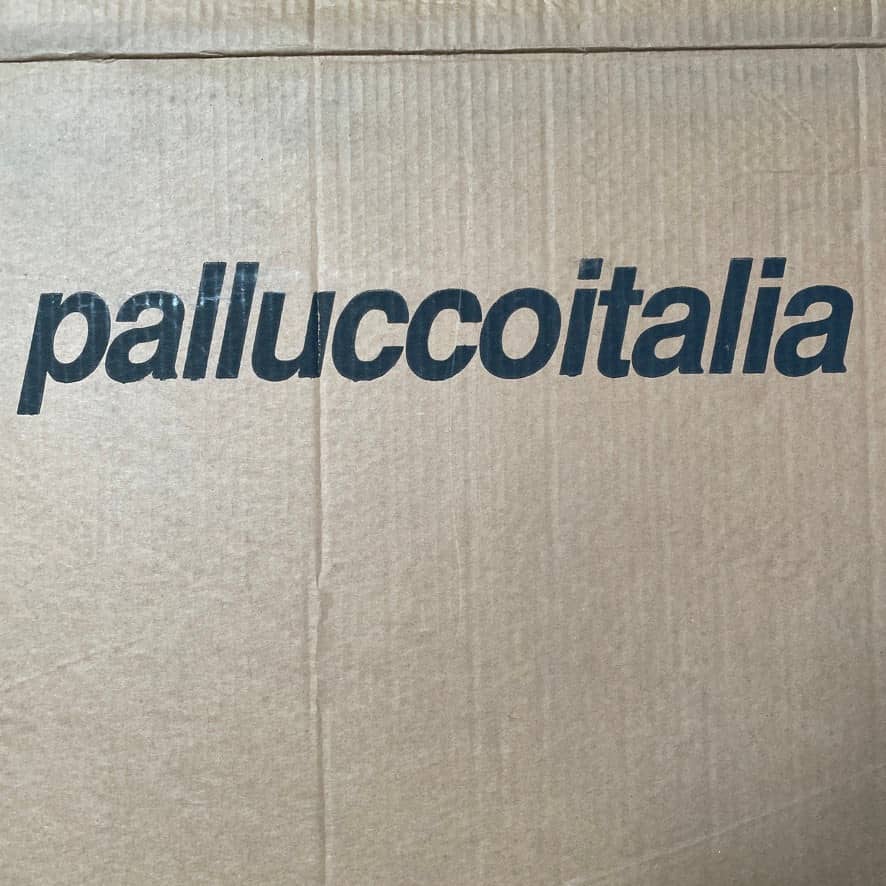 A stylish design of a Pallucco Italia Ono Suspension Light suspended on a white background by Pallucco Italia.