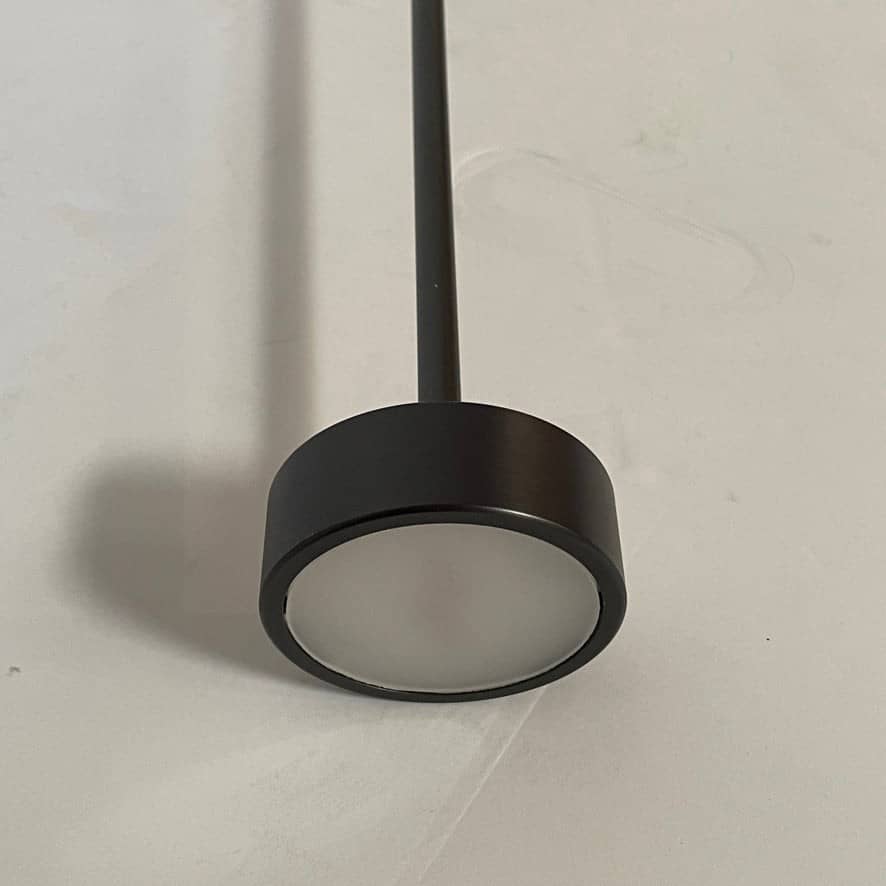 A Giopato & Coombes Softspot Pendant light hanging from a ceiling.