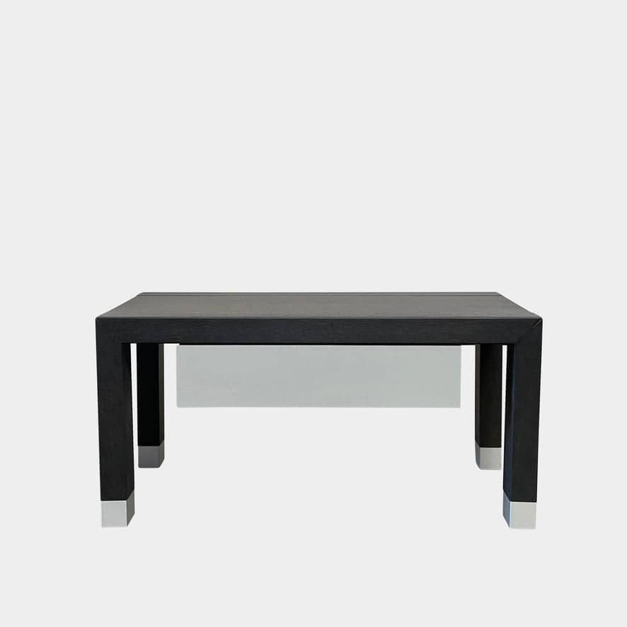 A black and white Ligne Roset Lumeo Nightstand with a drawer, reminiscent of Ligne Roset style.