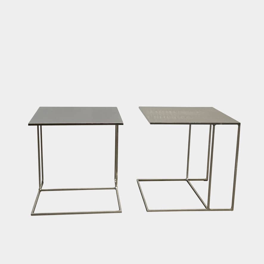 The Minotti Leger Side Table, by Minotti, features a metallic accent with its metal frame, creating a clean and minimal design against a white background.