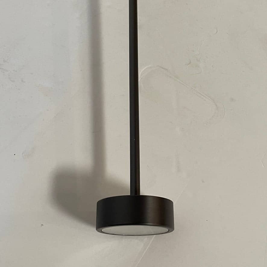 A Giopato & Coombes Softspot Pendant light hanging from a ceiling.