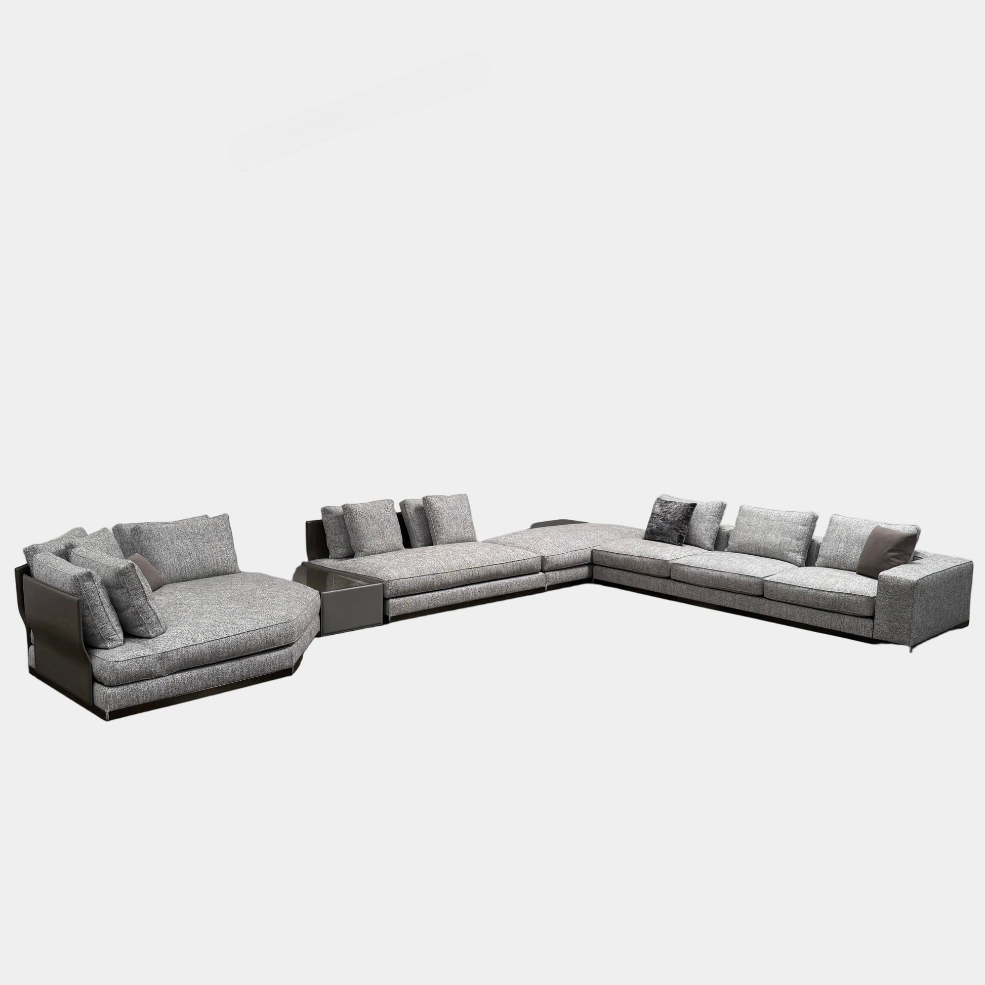 The Minotti West Sectional Sofa with Side Table and Clive Bench by Minotti features a large, L-shaped modern design with gray upholstery, multiple plush cushions, and an integrated side table—perfect for elevating luxury living rooms—all set against a plain white background.