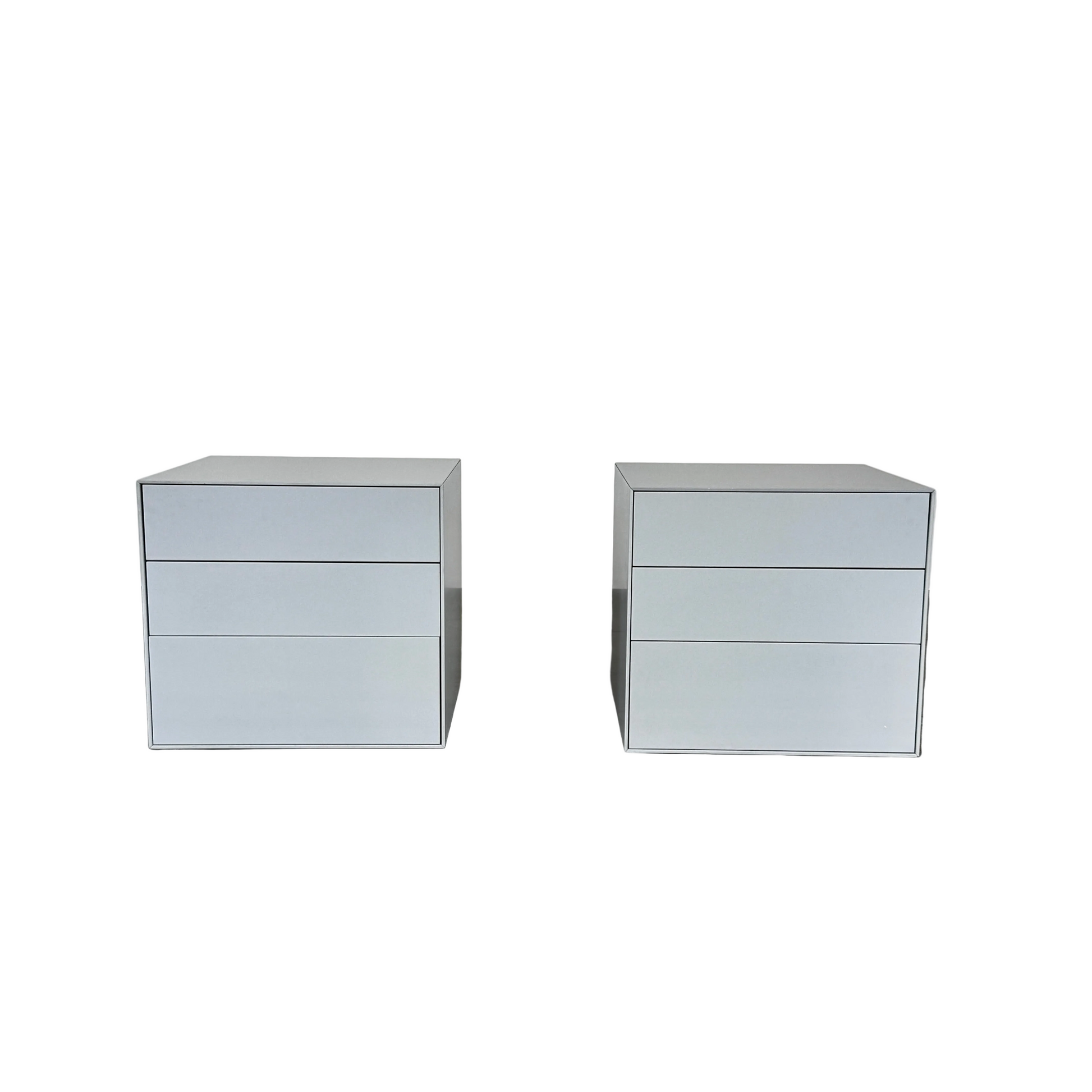 The Treku Lauki collection Side Table (2) by Treku, a gray rectangular side table with three drawers and a minimalist design, is shown against a plain white background.