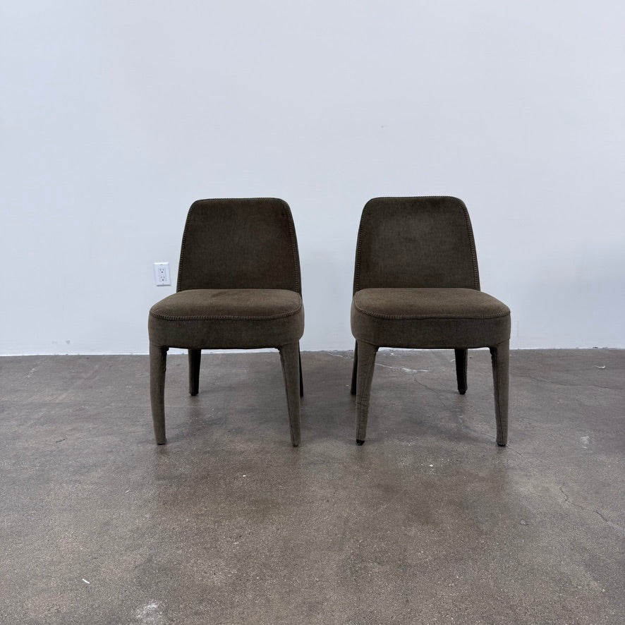 Two dark gray Maxalto Febo dining chairs with backrests, leather upholstery, and four tapered legs.