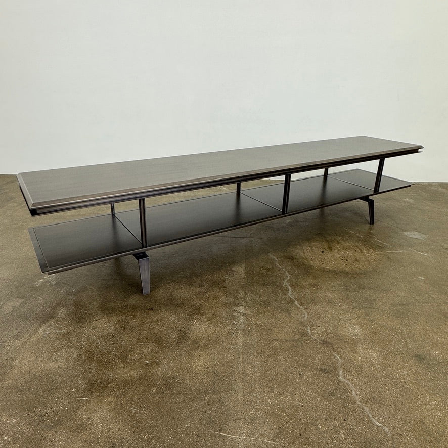 The Gallotti & Radice Pandora Console is a modern black TV stand featuring two open shelves and slim legs, shown on a plain white background. Check dimensions to ensure it fits your space perfectly.