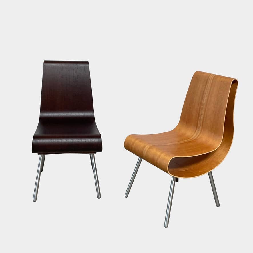 Two unique Emmemobili Boa accent chairs made of curved beech plywood on a white background.