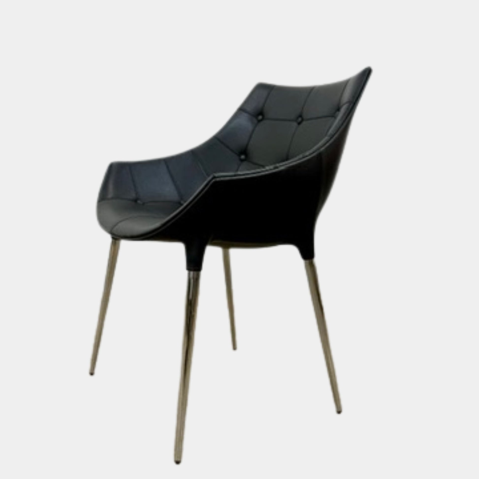 The Cassina Passion Side Chair by Cassina is a modern black upholstered chair with a curved backrest, button detailing, and four sleek metal legs inspired by the Passion design.