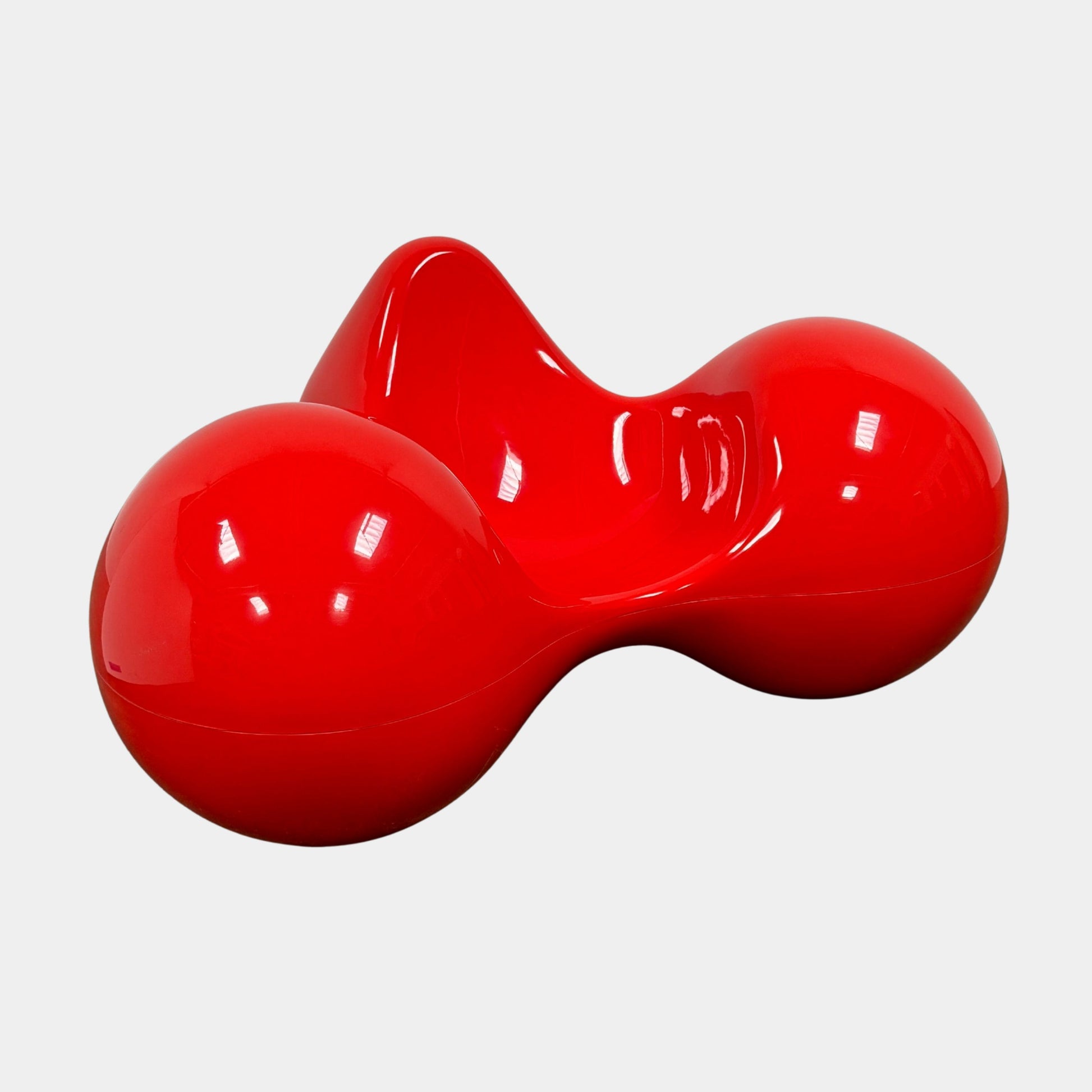 The Eero Aarnio Originals Tomato Chair by Eero Aarnio Originals is a glossy red modern plastic chair with three rounded, connected sections, inspired by the original design and shown against a plain white background.