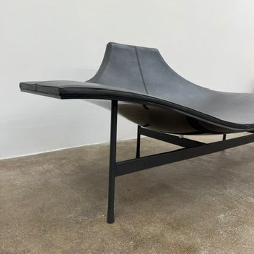 The B&B Italia Terminal 1 Lounge is a modern black bench with Jean-Marie Massaud’s sculpted, wave-like seat, a raised central backrest, and a minimalist black metal frame by B&B Italia.