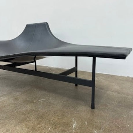 The B&B Italia Terminal 1 Lounge is a modern black bench with Jean-Marie Massaud’s sculpted, wave-like seat, a raised central backrest, and a minimalist black metal frame by B&B Italia.