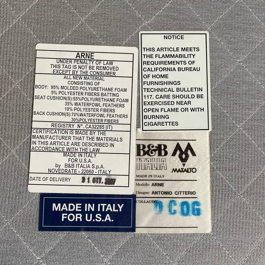 Modern upholstered l-shaped sectional B&B Italia Arne Sofa designed by Antonio Citterio, with cushions on a white background.