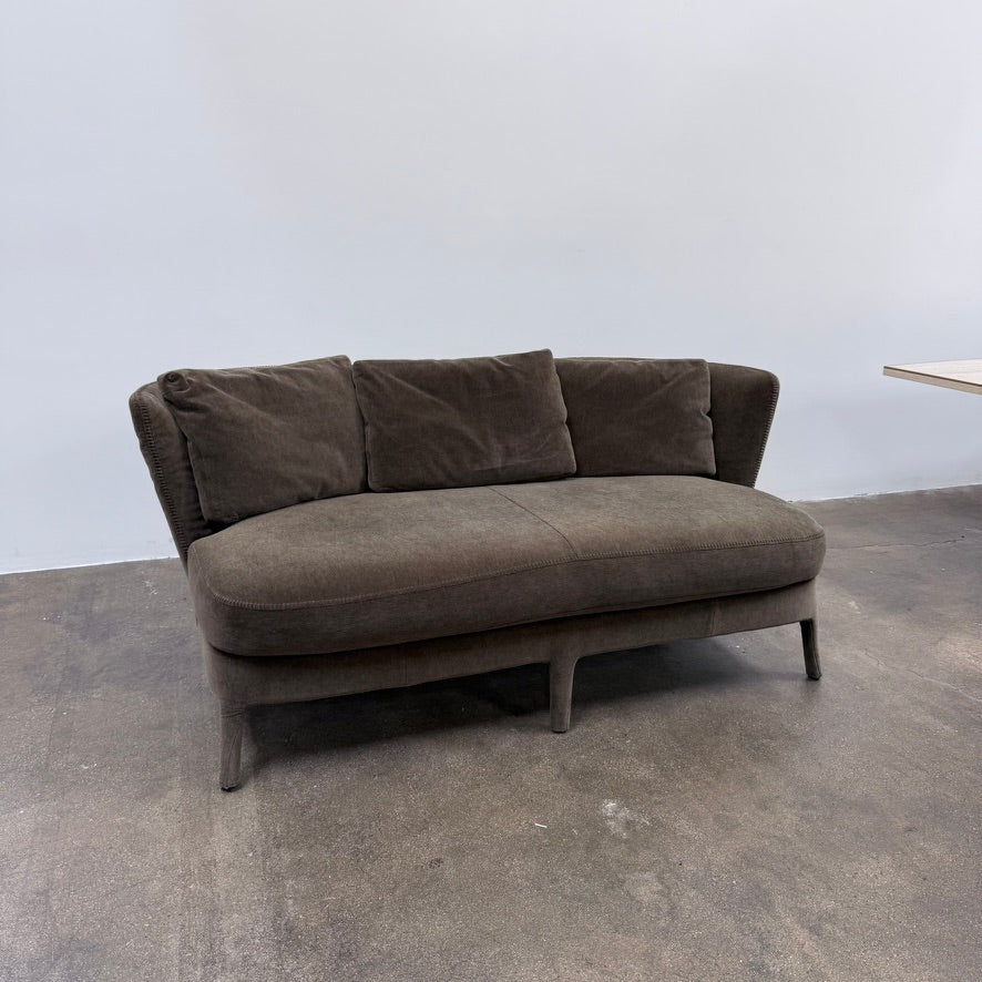 Small gray Maxalto Febo Small Sofa with a curved back, three back cushions, and visible stitched seams.