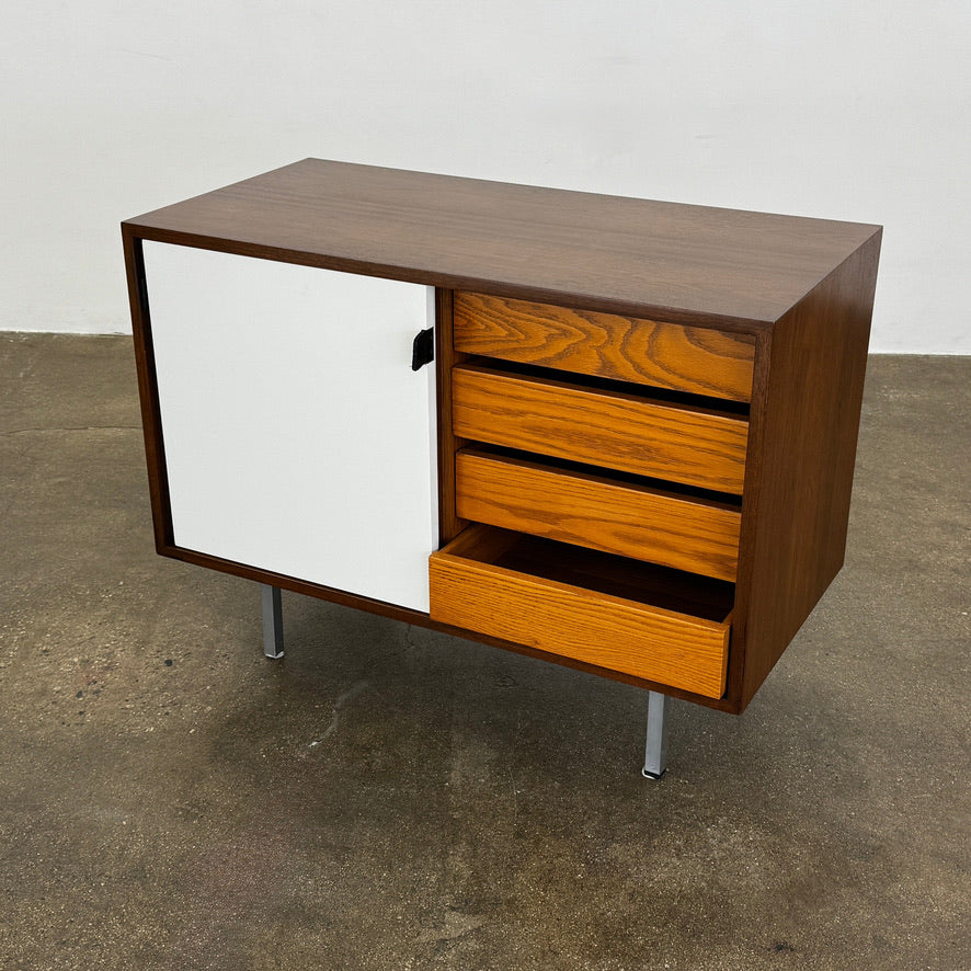 The Knoll Vintage Florence Knoll Office Storage features a dark wood frame, white sliding doors, and metal legs—perfect as a stylish credenza or office storage against a plain white wall.