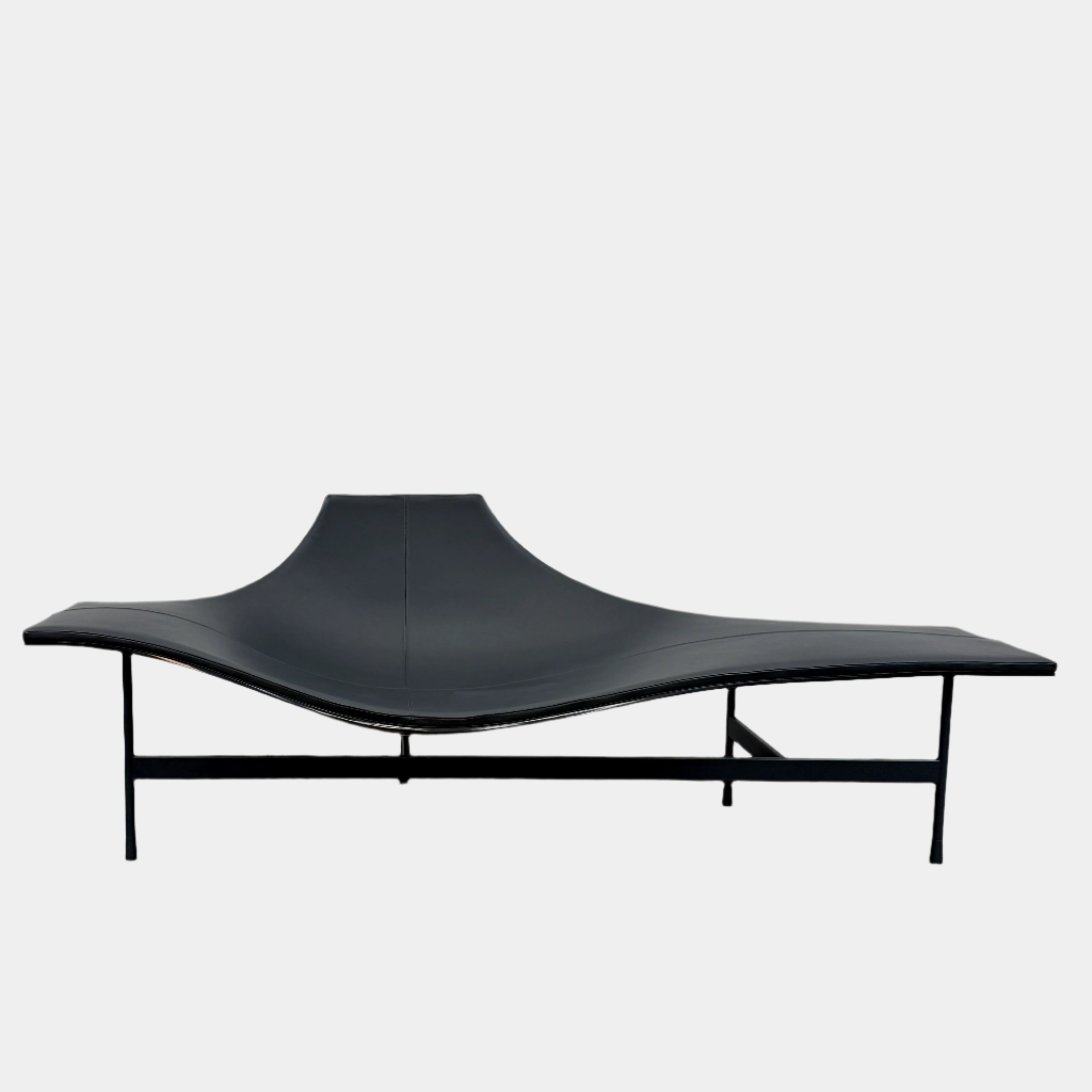 The B&B Italia Terminal 1 Lounge is a modern black bench with Jean-Marie Massaud’s sculpted, wave-like seat, a raised central backrest, and a minimalist black metal frame by B&B Italia.