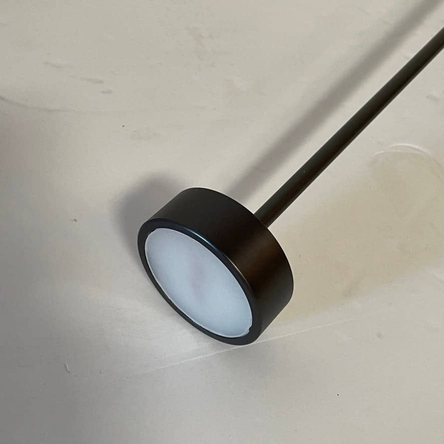 A Giopato & Coombes Softspot Pendant light hanging from a ceiling.