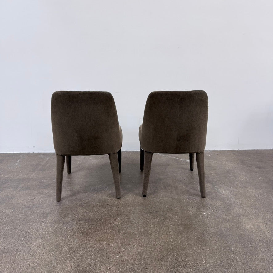 Two dark gray Maxalto Febo dining chairs with backrests, leather upholstery, and four tapered legs.