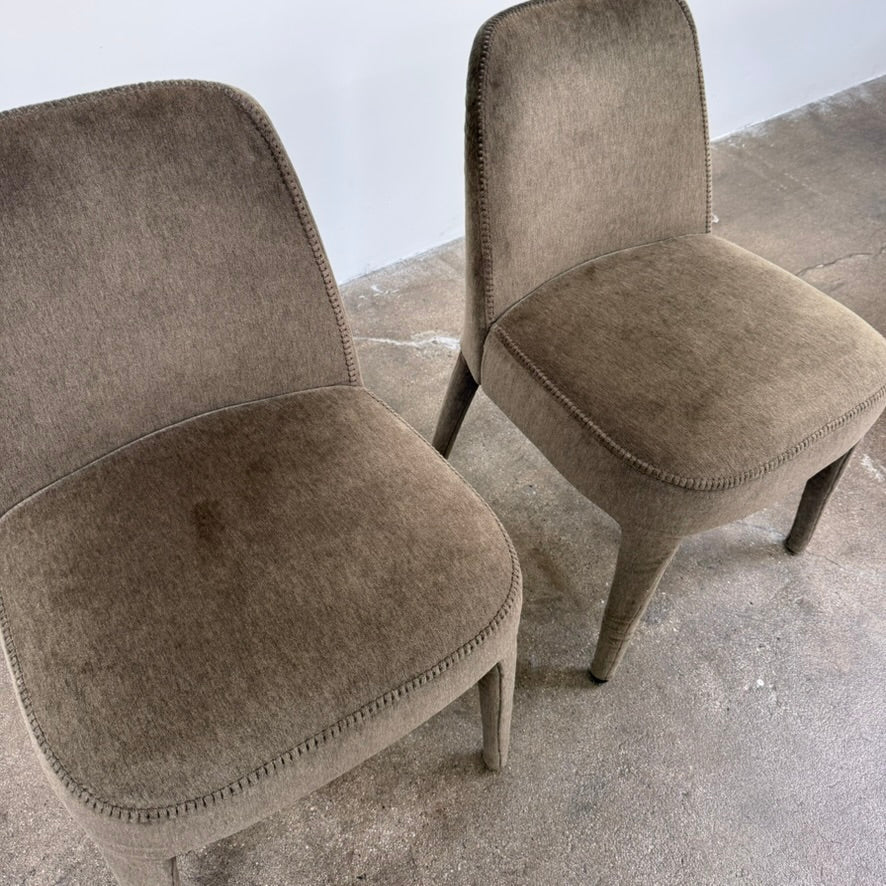 Two dark gray Maxalto Febo dining chairs with backrests, leather upholstery, and four tapered legs.