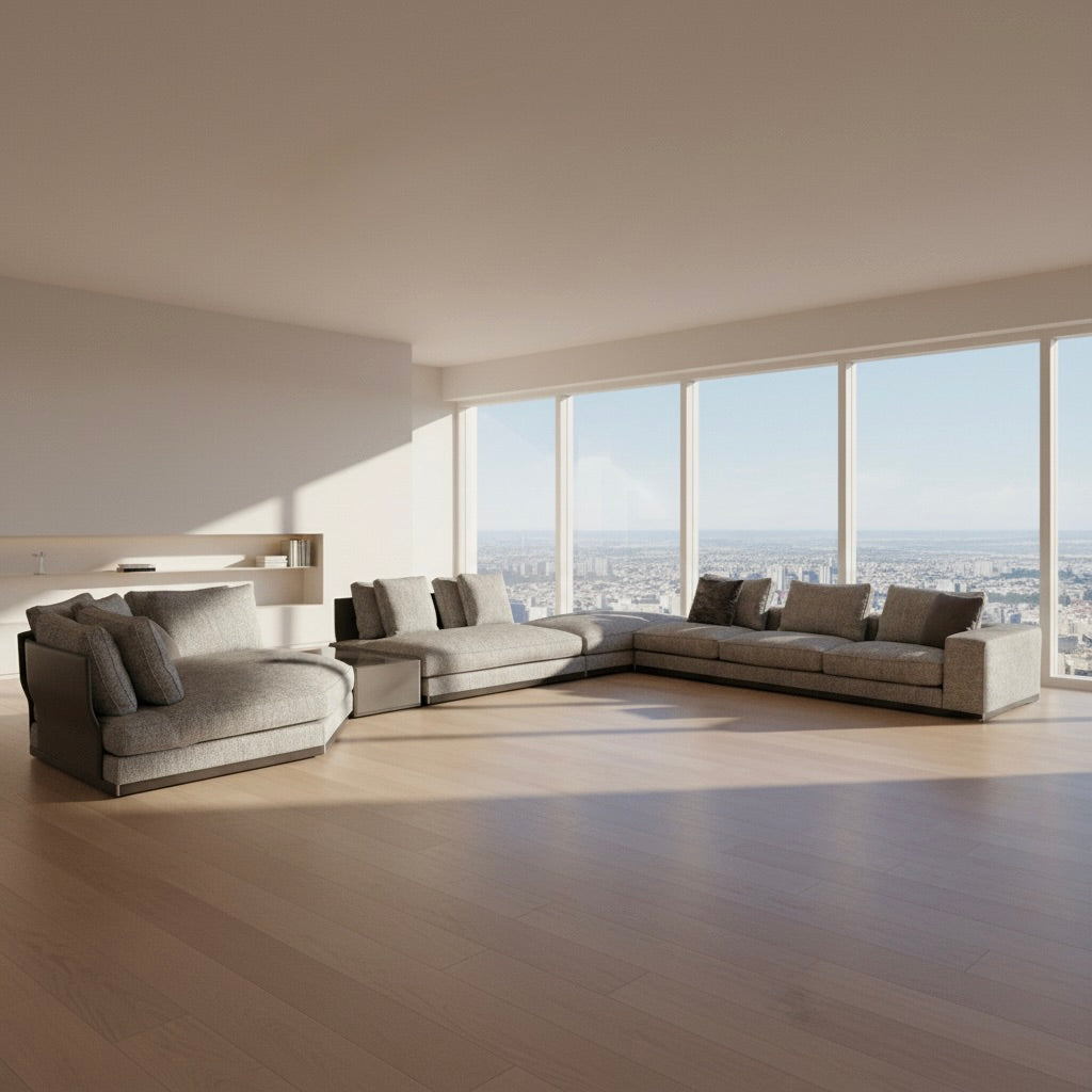 The Minotti West Sectional Sofa with Side Table and Clive Bench by Minotti features a large, L-shaped modern design with gray upholstery, multiple plush cushions, and an integrated side table—perfect for elevating luxury living rooms—all set against a plain white background.